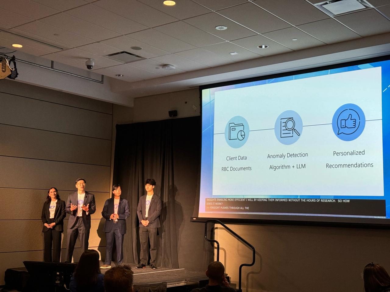 David pitching an AI tool on stage with his team at RBC Amplify